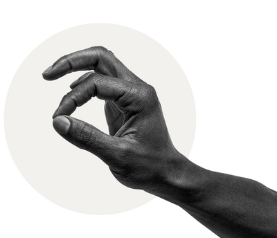 Close-up of a man's hand with dark skin making an "OK" gesture against a light circular background.