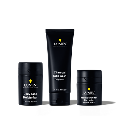 Lumin men's skincare set with charcoal face wash, daily face moisturizer, and instant dark circle corrector in black packaging