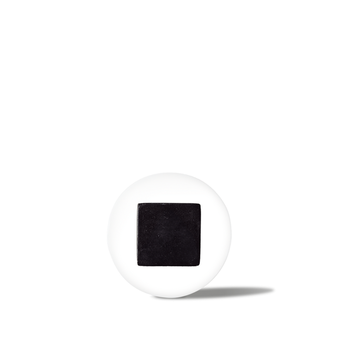 White pill with a black square imprint, medicine tablet for prescription or over-the-counter use.