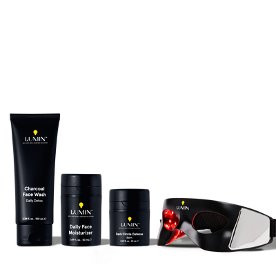 Men's skincare set with charcoal face wash, daily face moisturizer, dark circle defense balm, and LED light therapy eye mask