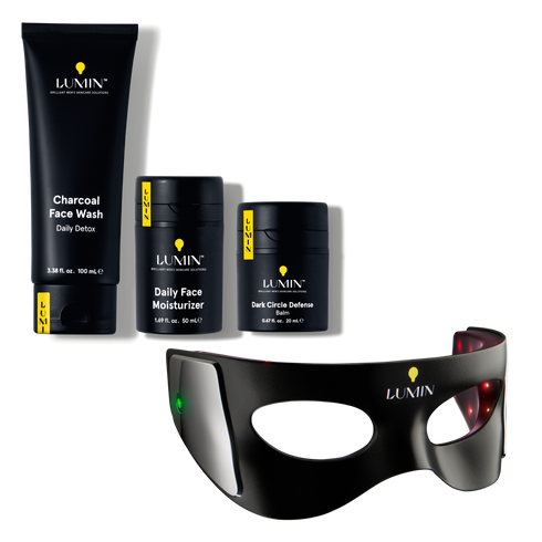 Lumin men's skincare set featuring charcoal face wash, daily face moisturizer, dark circle defense balm, and a high-tech eye treatment device.