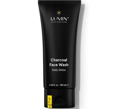 Black tube of Lumin Charcoal Face Wash Daily Detox for men, 3.38 fl oz, charcoal skincare cleanser, men's grooming product.