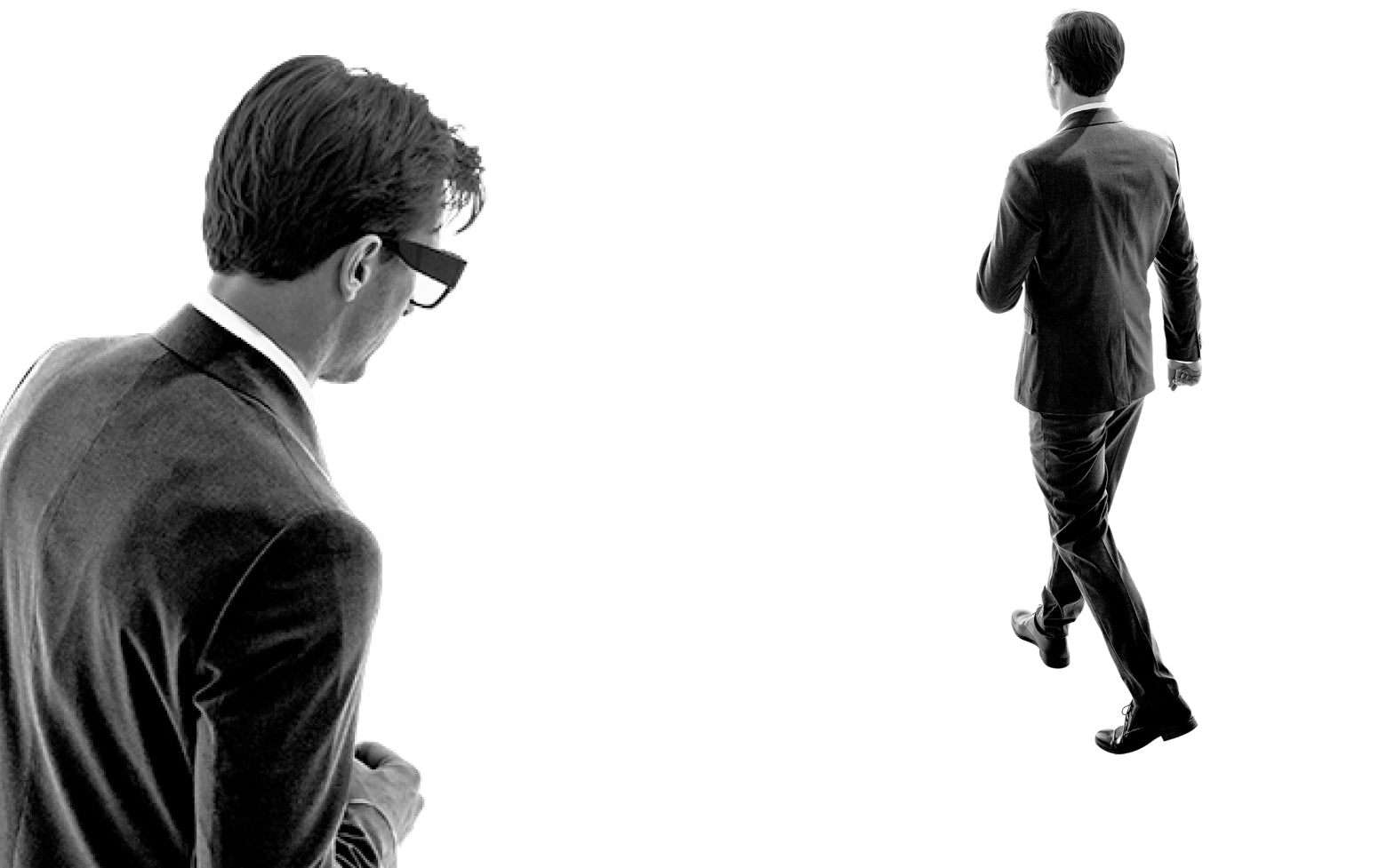 man walking away and man with glasses looking down