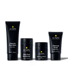 Lumin men's skincare set with Charcoal Face Wash, Daily Face Moisturizer, Dark Circle Defense Balm, and Charcoal Scrub.