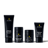 Lumin men's skincare set with Charcoal Face Wash, Extra Strength Moisturizer, Dark Circle Defense Balm, and Charcoal Scrub.