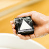 lumin pdp deep scrub face bar in hand
