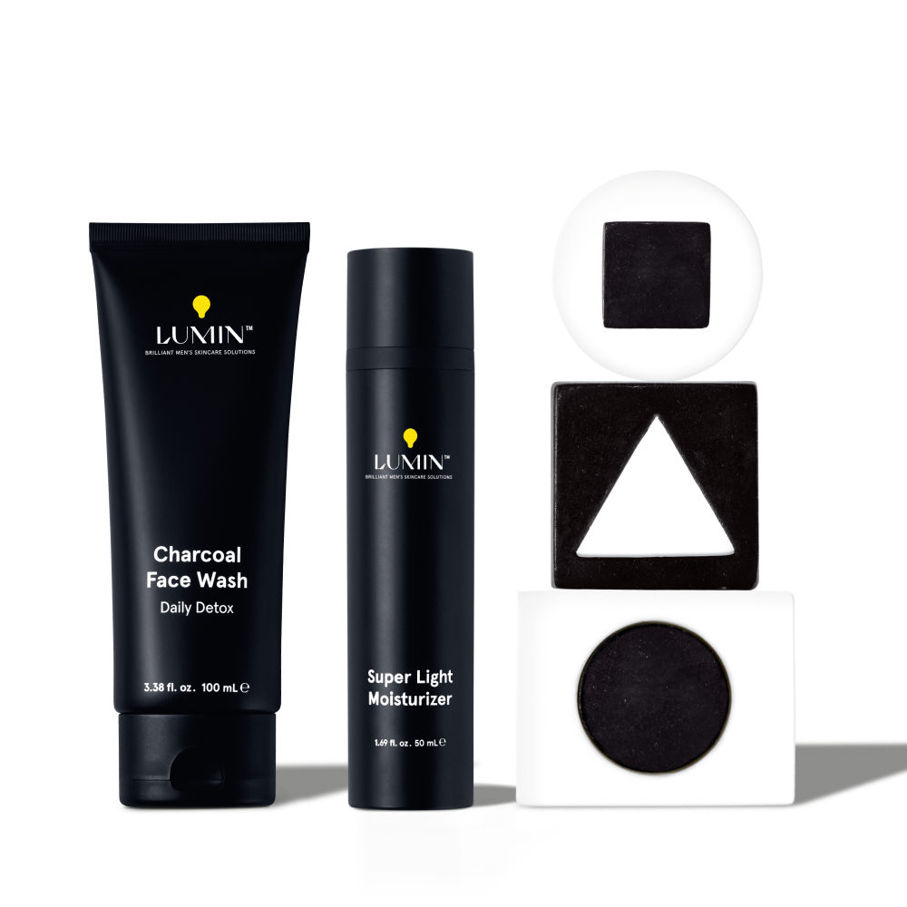 Lumin men's charcoal face wash and super light moisturizer with black and white geometric shapes for skincare routine.