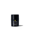 Lumin Instant Redness Corrector skincare product for men, 1.01 fl. oz. black travel-size container with yellow logo.