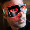 Man wearing Lumin LED light therapy mask around eyes for skincare and anti-aging facial treatment
