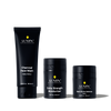 Lumin men's skincare set with Charcoal Face Wash, Extra Strength Moisturizer, and Dark Circle Defense Balm in black packaging.